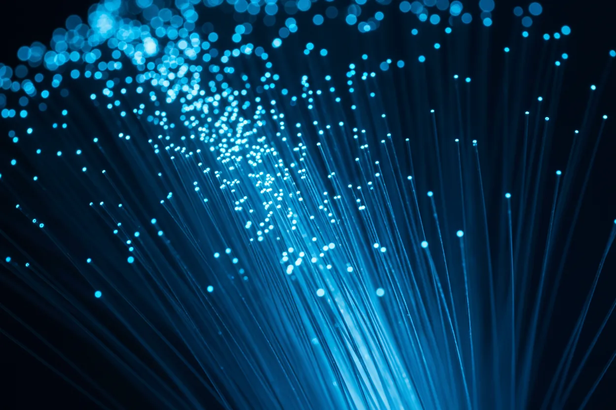 Fiber-optic strands glowing electric blue